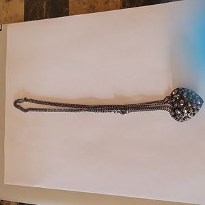 Heart dark gray Metalic necklace 19” long heart is 1.5” wide and 1 “ high.